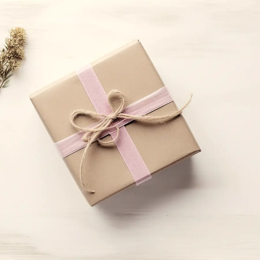 A gift box wrapped in kraft paper and tied with twine.